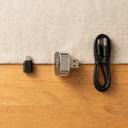 What's in the box: adapter, USB-C adapter, and extension cable